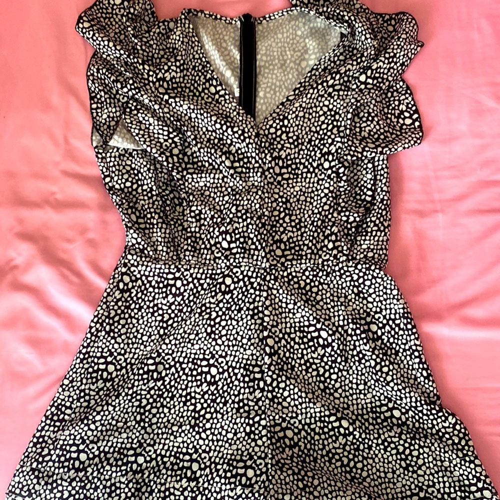 Beautiful black with white pattern romper. Size Medium.